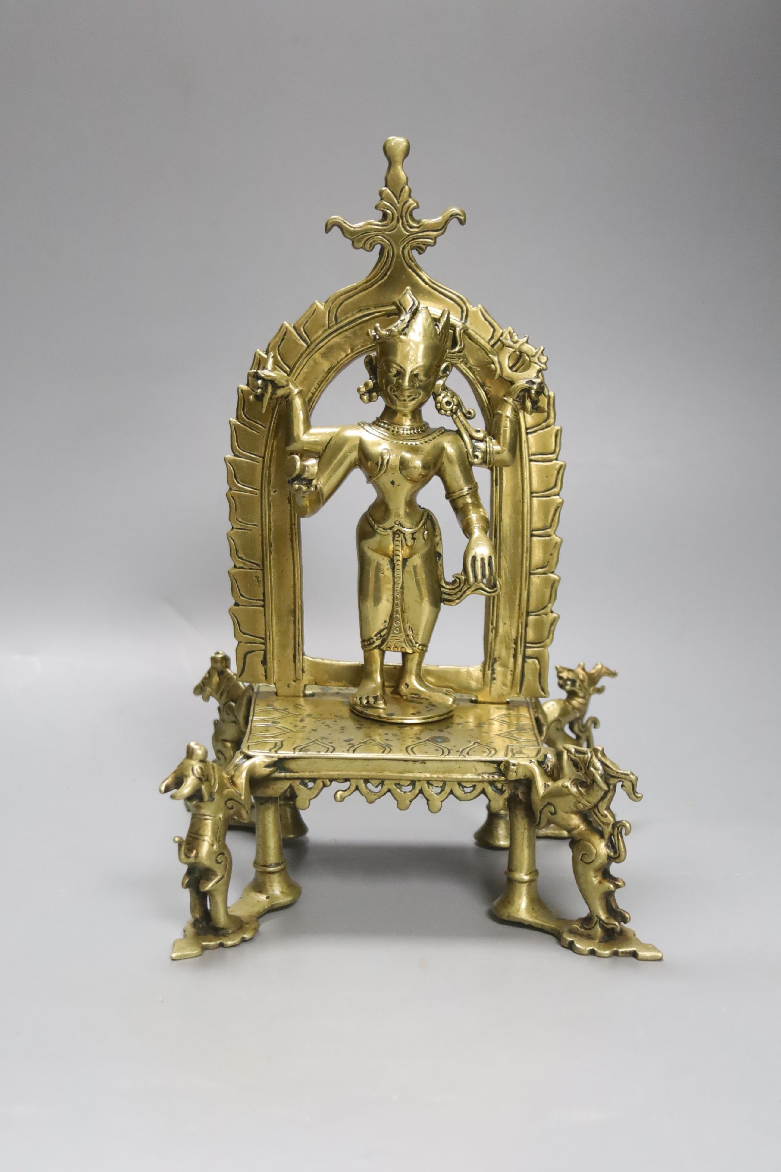 A brass / bronze Indian shrine, height 26cm